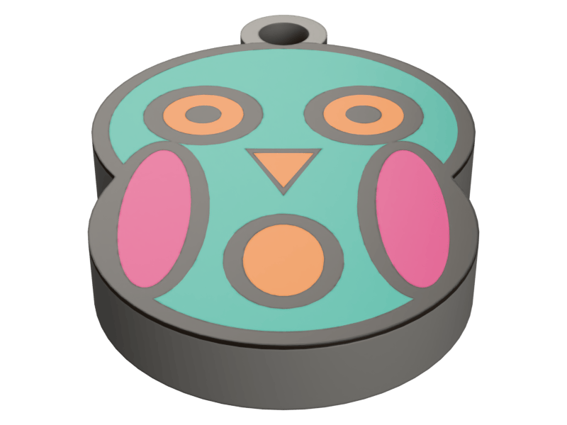 A round printed keychain fob carrying an owl face: a teal ground with two large orange-ringed eyes, a small orange beak and a round orange belly between pink side panels, all divided by grey printed outlines, with a bored keyring lug at the top